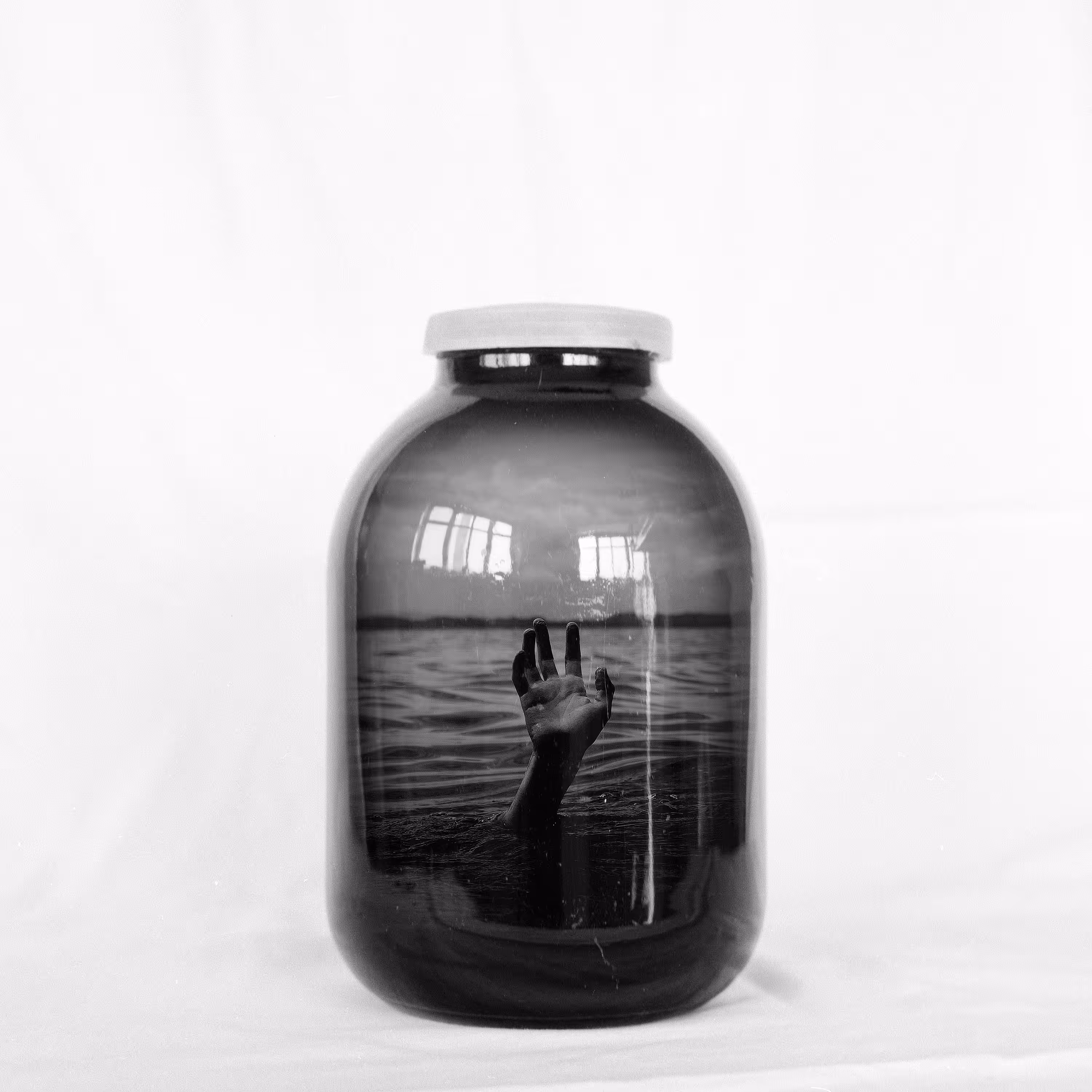 Jar with drowning person