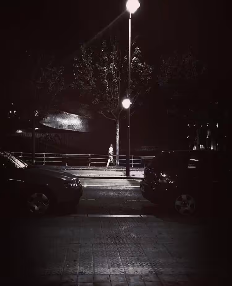  Man walking in front of the Guggenheim under the lantern