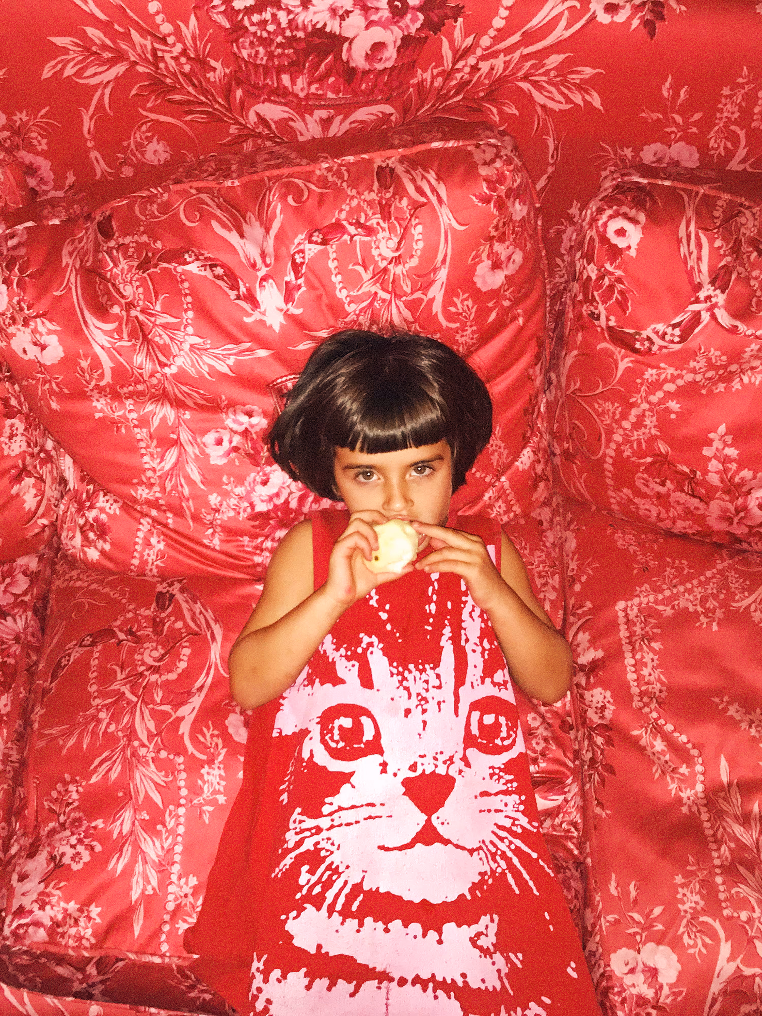 Pia on Red Couch