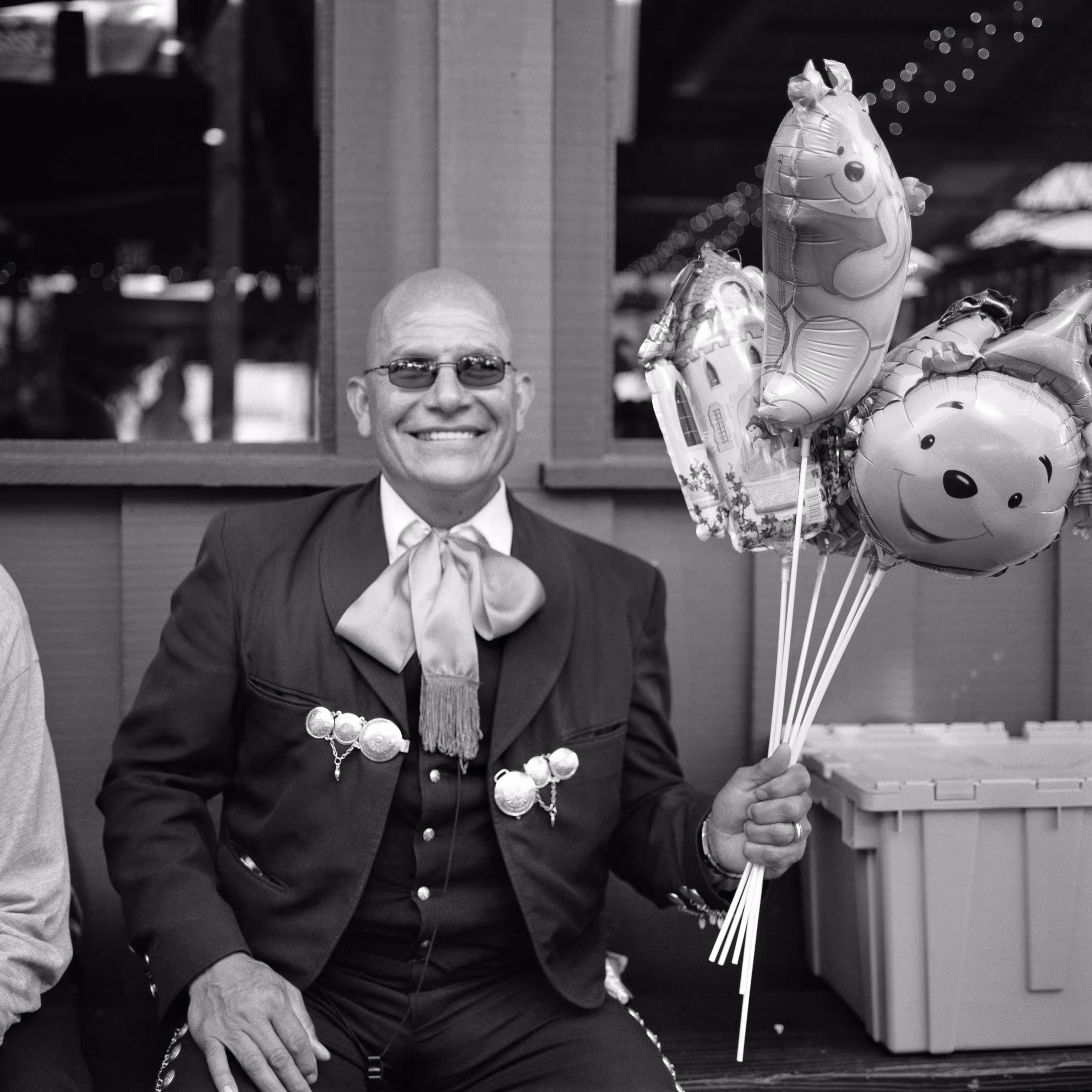 THE VILLAGE #34 MARIACHI HOLDING BALLOONS by Deanna Templeton