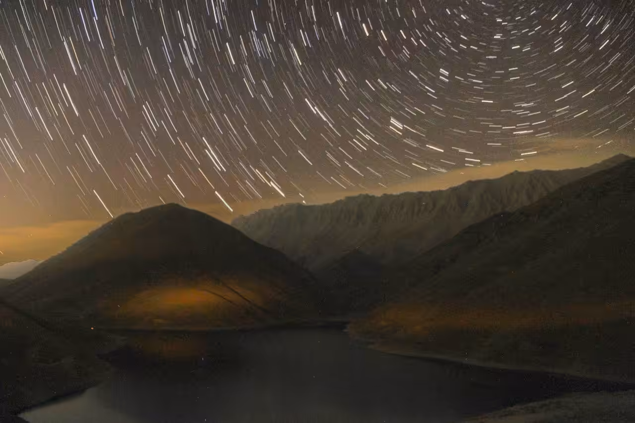 Celestial Symphony Over Tranquil Peaks